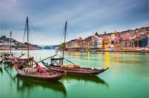 Vibrant city spaces of Porto and traditional Rabelo boats on the Douro River Vibrant city spaces of Porto and traditional Rabelo boats on the Douro River